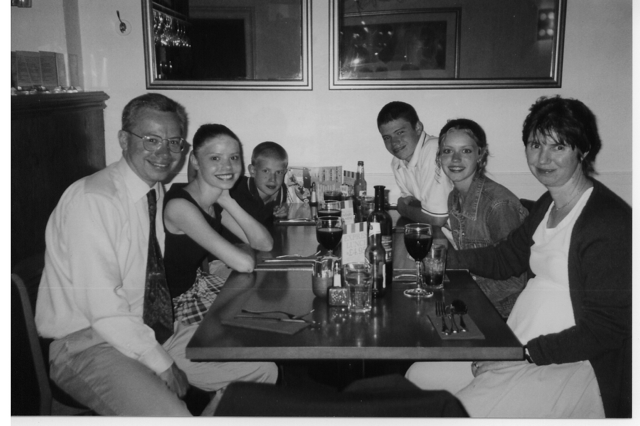 Photo of Cathy and family dining at a restaurant