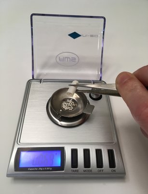 pouring beads onto digital scale