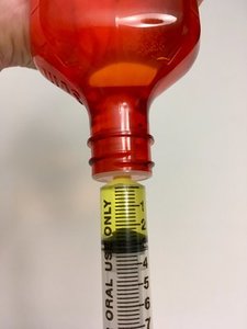 syringe in adapter cap